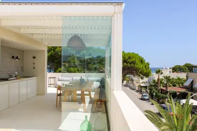 a balcony with a table and a view of the ocean at Villa Ippolita - Studio with Esclusive Terrace in San Vito lo Capo