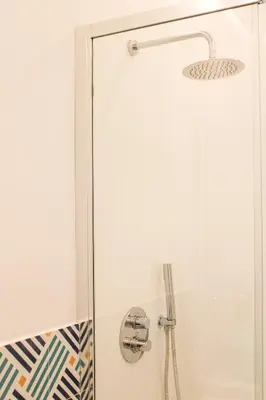 a shower with a glass door in a bathroom at Villa Ippolita - Apartment with Exclusive Garden in San Vito lo Capo