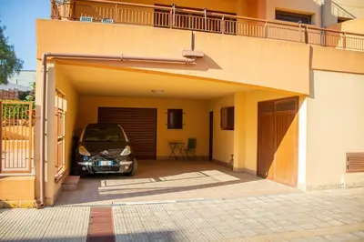 a car parked in the garage of a house at Casa Leandra in Casteldaccia