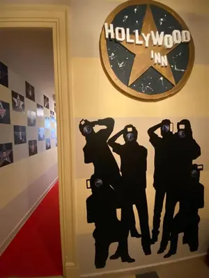 a wall art in a hotel room with a hollywood sign at Hollywood Inn Palermo in Palermo