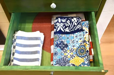 a green drawer filled with towels and towels at Enjoy Palermo in Palermo