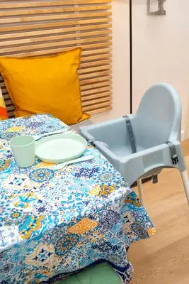 a blue chair sitting next to a bed at Enjoy Palermo in Palermo