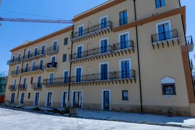 a large building with balconies on the side of it at Casa Erasmo in Palermo