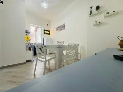 a dining room with a table and chairs at That's Amuri in Palermo