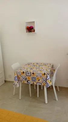 a table with a table cloth on top of it at Scialari - Palermo Holiday Home in Palermo