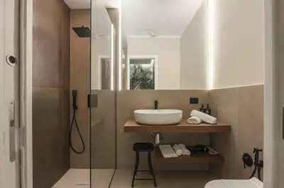 a bathroom with a sink and a shower at Lolli Boutique & SPA Al Massimo in Palermo