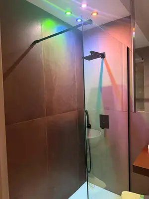 a shower with a glass door in a bathroom at Lolli Boutique & SPA Al Massimo in Palermo
