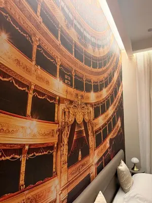 a large painting on a wall in a bedroom at Lolli Boutique & SPA Al Massimo in Palermo