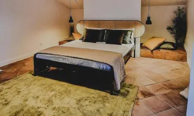 a bedroom with a large bed in a room at Domus Dea in Mondello