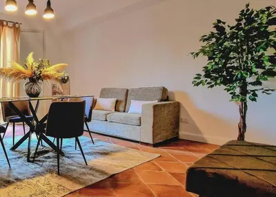 a living room with a couch and a table at Domus Dea in Mondello
