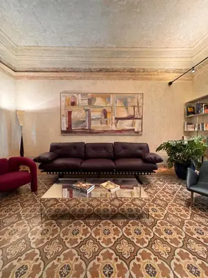a living room with a couch and a coffee table at Gilded Age Luxury dream apartment historic center in Palermo
