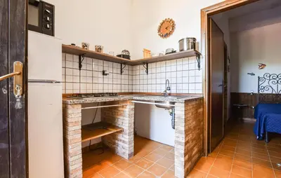 a small kitchen with a sink and a stove at Nice Apartment In Trappeto With Wifi in Trappeto