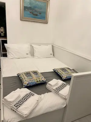 two beds in a room with towels on them at Appartamenti Tiffany & Timi in Carini