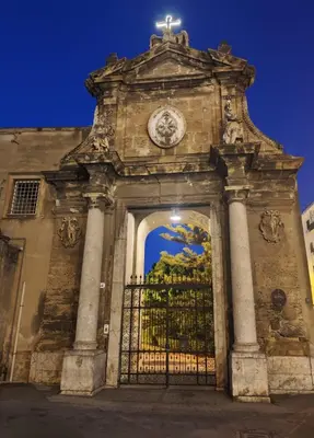 a building with a gate with a cross on top at Casuzza del genio in Palermo