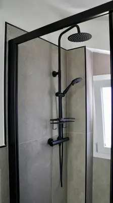 a shower in a bathroom with a glass door at Villa Zagara modern villa with pool in Lascari