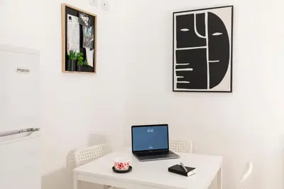 a white desk with a laptop on top of it at Casa del Saraceno in Palermo