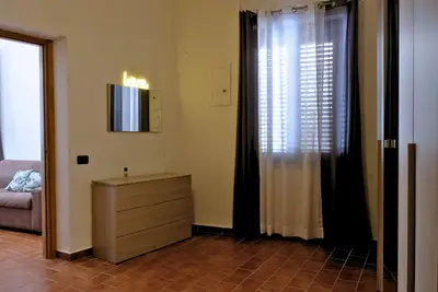 a bedroom with a bed with two towels on it at Romantichouse in Palermo