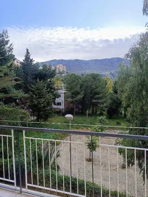 a balcony with a view of a yard with trees at Casa Hyccarina in Carini
