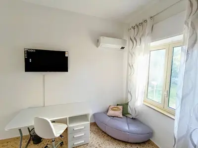 a room with a white desk and a window at Casa Hyccarina in Carini