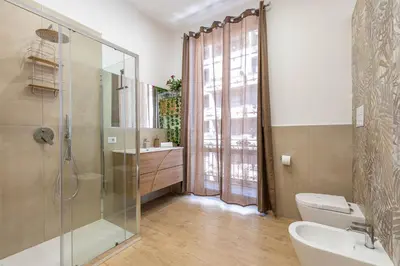 a bathroom with a shower and a sink and a toilet at Casa Florio Love Palermo in Palermo