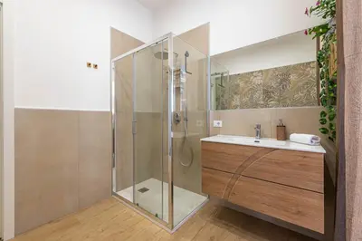 a bathroom with a shower and a sink at Casa Florio Love Palermo in Palermo