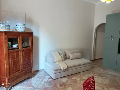 a living room with a couch and a cabinet at Il Gelsomino in Bagheria