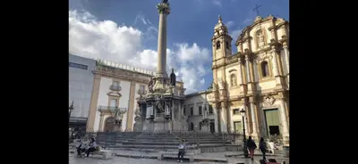 a large building with a column in front of it at Casa vucciria in Palermo