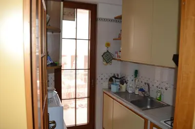 a small kitchen with a sink and a window at Villa Eugenia - Mondello Beach in Palermo