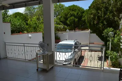a car parked on a balcony with a fence at Villa Eugenia - Mondello Beach in Palermo
