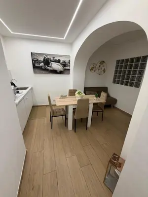 a bedroom with a large bed with two lamps at Maison Ferba in Palermo