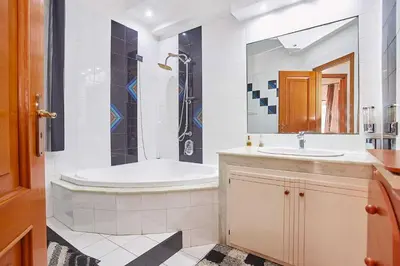 a bathroom with a tub and a sink and a shower at Appartamento vista mare in Castellammare del Golfo