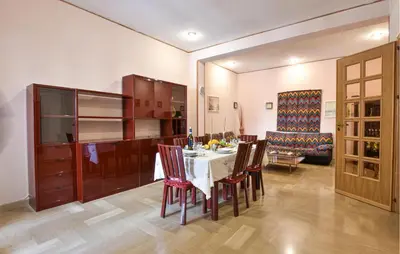 a kitchen and dining room with a table and chairs at Cozy Apartment In Trappeto With Wifi in Trappeto