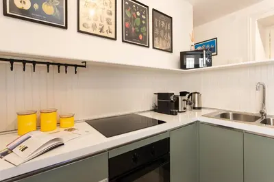 a kitchen with a sink and a counter top at Finestre sul Massimo - Centro Storico Palermo in Palermo