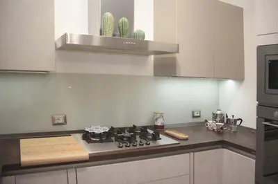 a kitchen with a stove top in a kitchen at Montalcini 3 in Capaci