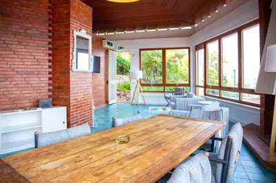 a dining room with a wooden table and chairs at Solemar Sicilia - Villa Giovitto in Bagheria