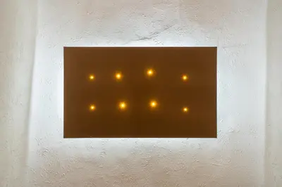 a wall with a picture of lights on it at Historic soul apartment in Palermo