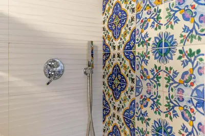 a shower in a bathroom with a shower curtain at Historic soul apartment in Palermo