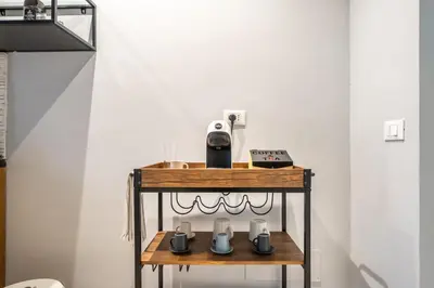 a kitchen with a sink and a counter at Historic soul apartment in Palermo