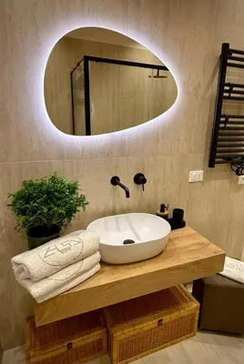 a bathroom with a white sink and a mirror at Zisa Suite 2 in Palermo