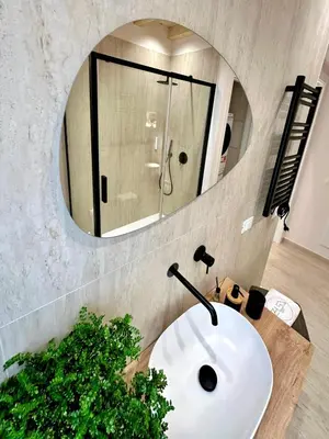 a shower with a glass door in a bathroom at Zisa Suite 2 in Palermo