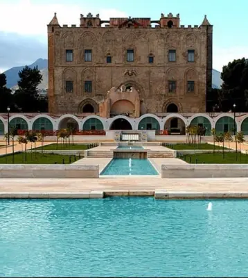 a large brick building with many doors and windows at Zisa Suite 2 in Palermo