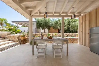 an outdoor dining room with a table and chairs at 14th Oasis Family Room In Villa With Pool Near Palermo in Carini
