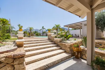 a set of stone stairs leading to a house at 14th Oasis Family Room In Villa With Pool Near Palermo in Carini