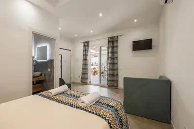 a bedroom with a large bed with two pillows on it at 14th Oasis Family Room In Villa With Pool Near Palermo in Carini