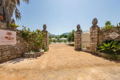 a gate to a villa with a sign that reads excuses at 14th Oasis Villa With Private Pool Near Palermo in Carini