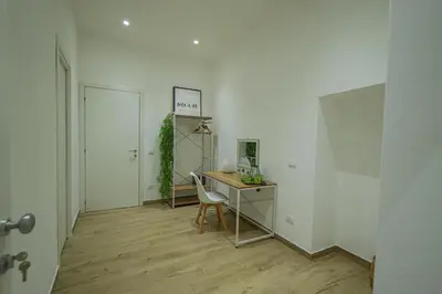 an office with a desk and a chair in a room at Beta Suite in Palermo
