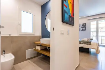 a bathroom with a tub and a sink and a toilet at Capo D'Amuri in Palermo