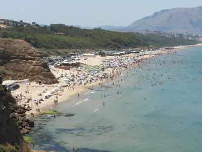 a beach with a lot of people in the water at Casa Vacanze Fabrizio in Balestrate
