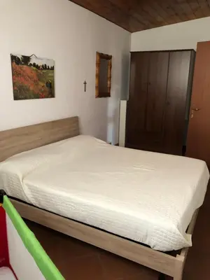 a bedroom with a bed in a room at Casetta Mondello in Mondello