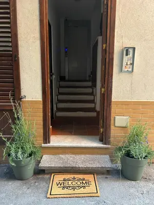 a welcome sign is in front of a door at Mercede rooms Ballaró in Palermo